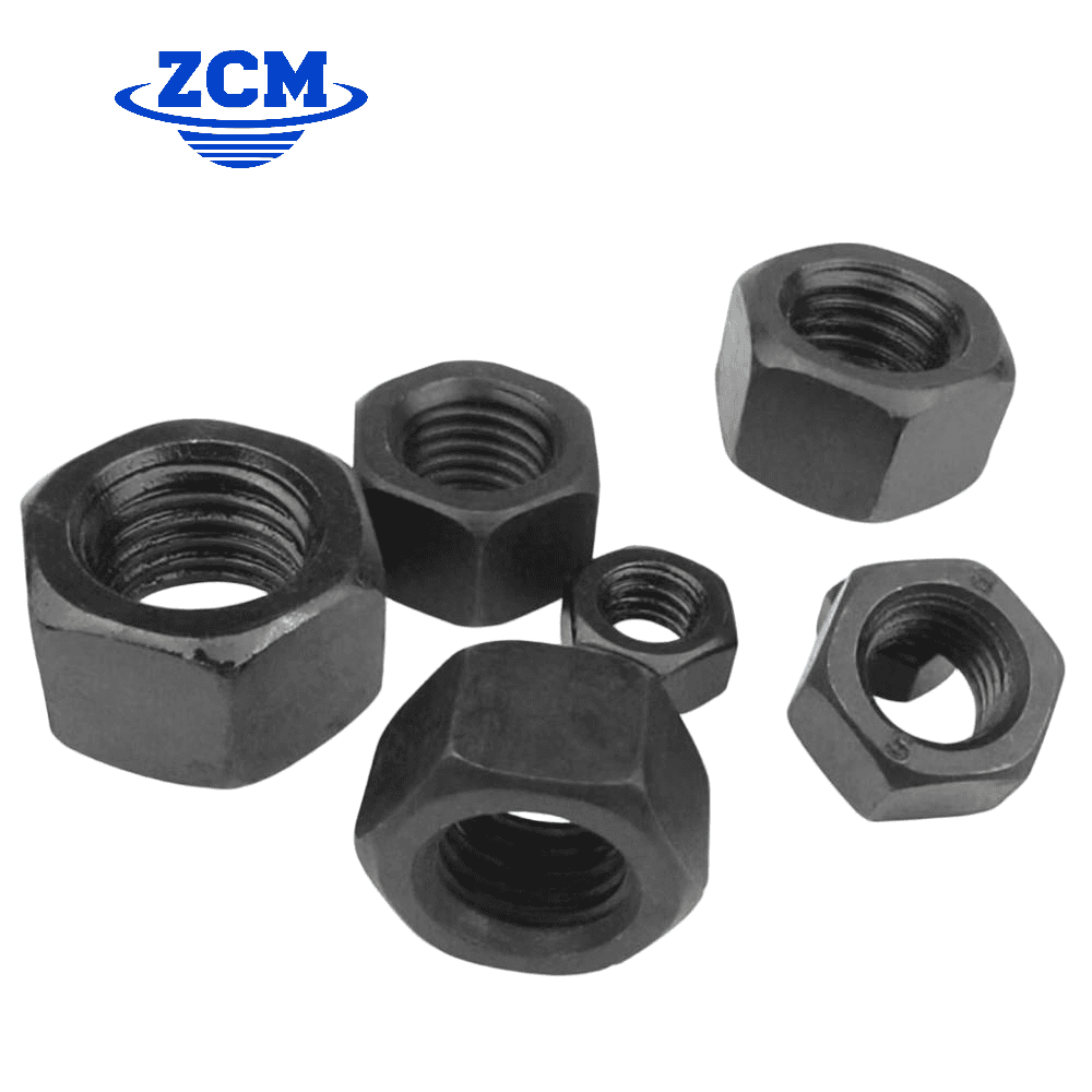Six black oxide hex nuts scattered showing different sizes by ZCM